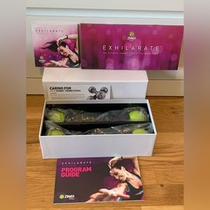 Zumba Exhilarate 8 DVD Set + 2 Toning Sticks Never Used
